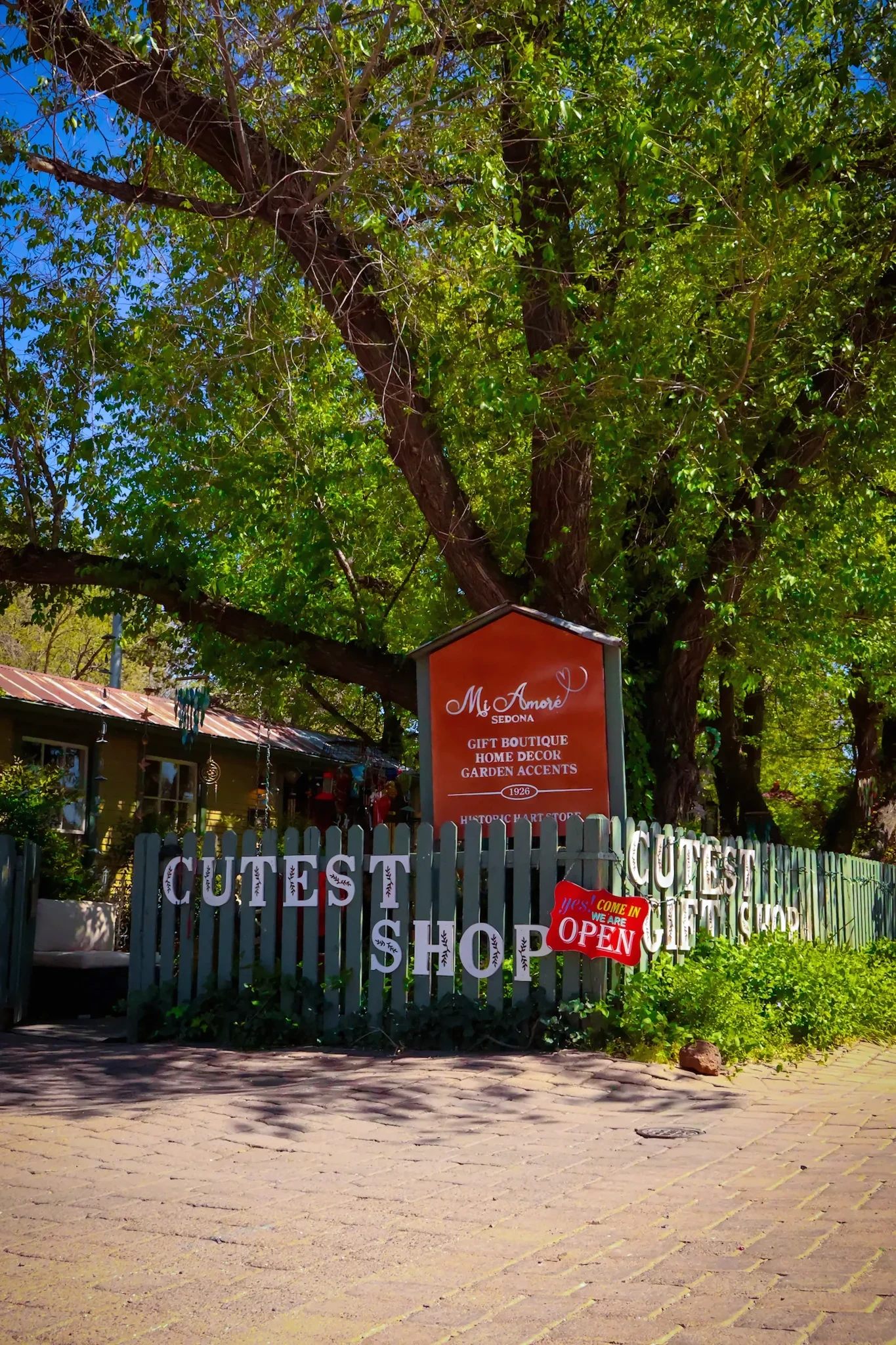 The garden gate and historic storefront at Mi Amore Sedona